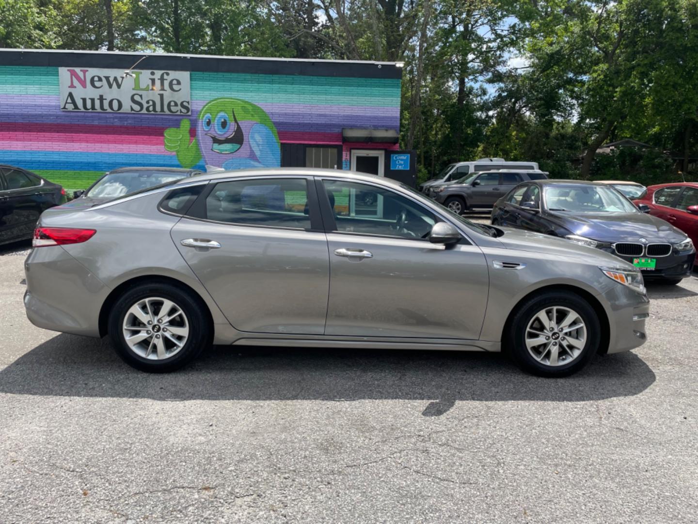 2018 GRAY KIA OPTIMA LX (5XXGT4L34JG) with an 2.4L engine, Automatic transmission, located at 5103 Dorchester Rd., Charleston, SC, 29418-5607, (843) 767-1122, 36.245171, -115.228050 - Roomy Interior with AUX/USB/Sat/Bluetooth, Power Windows, Power Locks, Power Mirrors, Backup Camera, Keyless Entry, Alloy Wheels. 118k miles Located at New Life Auto Sales! 2023 WINNER for Post & Courier's Charleston's Choice Pre-owned Car Dealer AND 2018-2024 Top 5 Finalist for Charleston City Pap - Photo#7